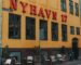 yellow and black concrete building at daytime